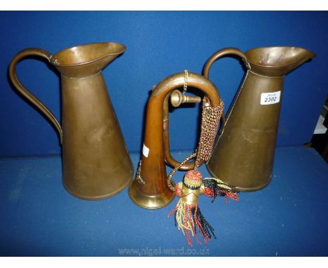 Two copper jugs and a bugle