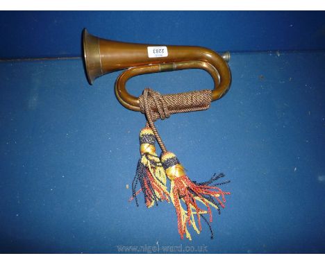 A copper and brass Bugle with tassels