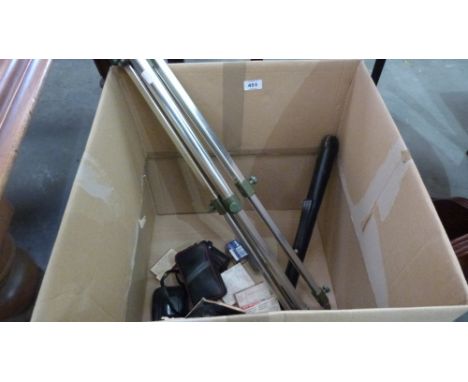 A camera tripod and other photographic equipment