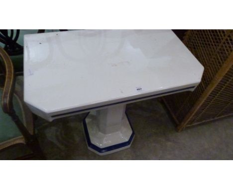 An Art Deco glazed ceramic pedestal washstand