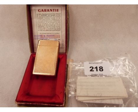 A Dupont gold plated engine turned lighter. Boxed