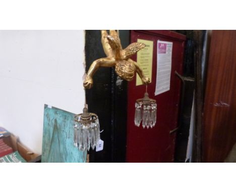 A gilt plaster cherubic hanging lamp, hung with prismatic pendant drops