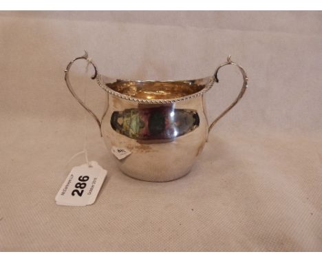 A George V silver sucrier with gadrooned rim. 5½'' wide over handles. Birmingham 1912. 3ozs 4 dwts