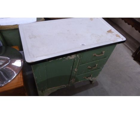 An enamel topped kitchen cupboard