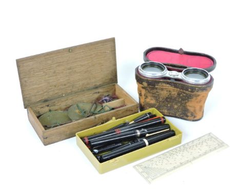 A quantity of calligraphy pens, a Waterman fountain pen, a scrimshaw ruler, a cased set of coin scales, and a pair of mother 