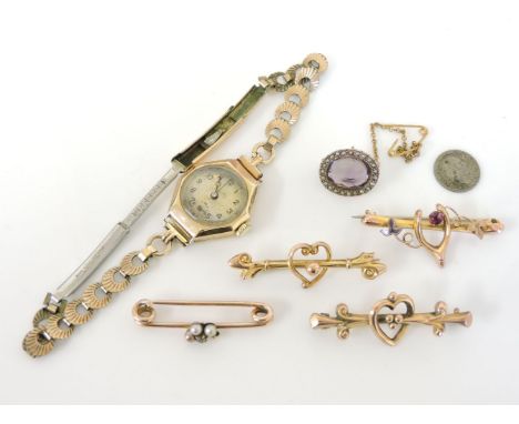 A gold diamond and seed pearl bar brooch, two deficient, untested, a gold oval cut amethyst and split pearl brooch, and a 9ct