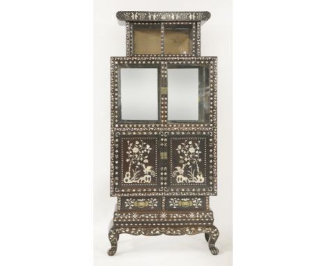 A late 19th century mother-of-pearl inlaid hongmu display cabinet, the upper section with two sliding doors above glazed and 