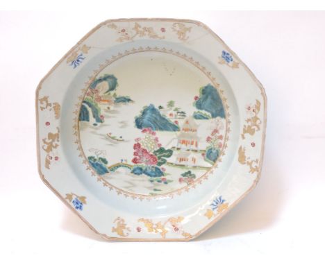 A Chinese famille rose octagonal basin, painted with buildings, willow and floral trees within a landscape, figures on a boat