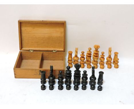 A carved boxwood and ebonised 'Regence' pattern chess set, c1900, in a light oak box, King 8.3cm, pawn 4.3cm