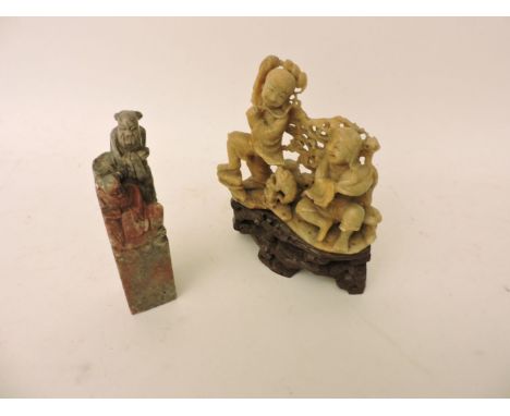 A Chinese soapstone group, 17cm high, and a soapstone table seal, 15.5cm