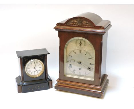 An early 20th century mahogany cased chiming mantel clock, and a Victorian black slate mantel clock