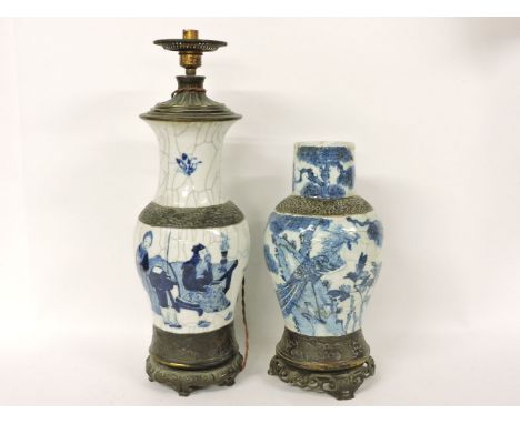 Two 19th century Chinese blue and white vases, one mounted as a table lamp, the other with a pierced and fixed stand, 55cm an