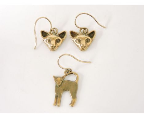 A pair of 9ct gold cat head earrings, and a single 9ct gold cat earring, 7.39g, a gold filigree shield stick pin, a single go