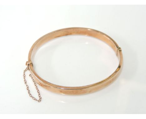 A 9ct rose gold bangle, damaged, 6.96g