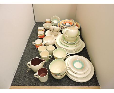 A collection of Clarice Cliff  Newport pottery, spring crocus items, Gray's pottery and Susie Cooper coffee cups, saucers and