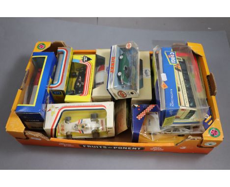Twelve Boxed Corgi Diecast Vehicles including Racing Cars, Fire Engine, Police Cars, Coaches, etc plus Boxed Dinky Jaguar