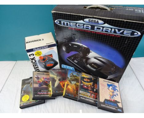 Retro Gaming - Boxed Sega Mega Drive console, a boxed Quick Shot Maverick 3 and 6 x Mega Drive games to include Sonic, Super 
