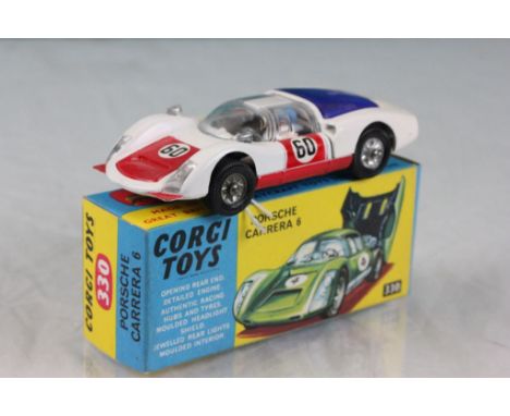 Boxed Corgi 330 Porsche Carrera 6 in white with red, complete with driver, race number 60, decals and diecast excellent, box 