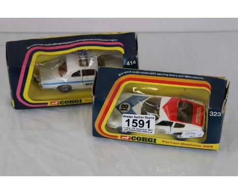 Two boxed Corgi diecast model vehicles to include 323 Ferrari Daytona 365 in white with blue & red and 414 Coastguard Jaguar 