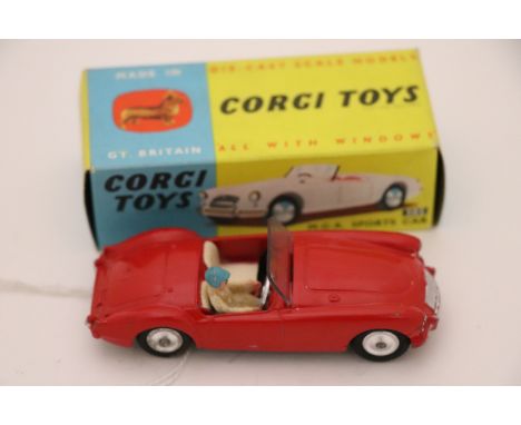 Boxed Corgi 302 MGA Sports Car in red with driver, windscreen vg, diecast vg with some paint chips, box excellent