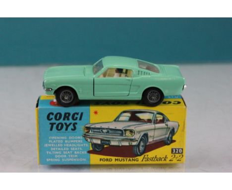 Boxed Corgi 320 Ford Mustang Fastback 2+2 in pale green with cream interior, diecast excellent, box gd with one end flap tape