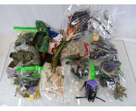 Large collection of vintage and other Action Man accessories to include; clothing, weapons and dog tags etc