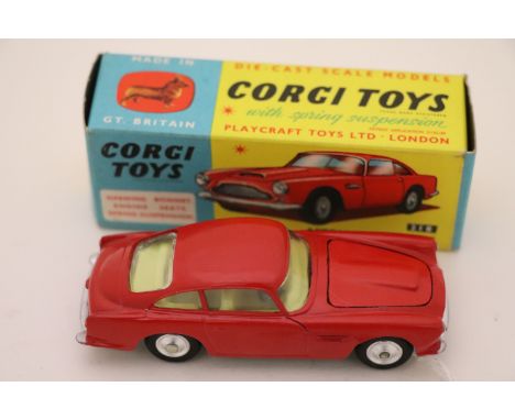 Boxed Corgi 218 Aston Martin DB4 in red with yellow interior, diecast excellent, box vg