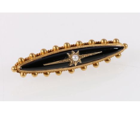Victorian gold onyx and pearl mourning brooch with locket back.