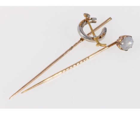 Stick pin with horse shoe and riding crop finial and another set with cabochon moonstone