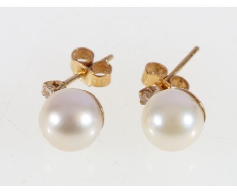 Pair of 18ct gold pearl and diamond ear studs, 2.6g.
