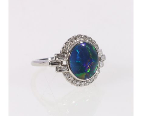 Diamond and black opal ring with baguettes and brilliants in white gold, Size 'L'. CONDITION REPORT: Small eight cut brillian