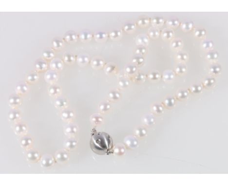 Freshwater pearl necklace with diamond set white gold ball snap.