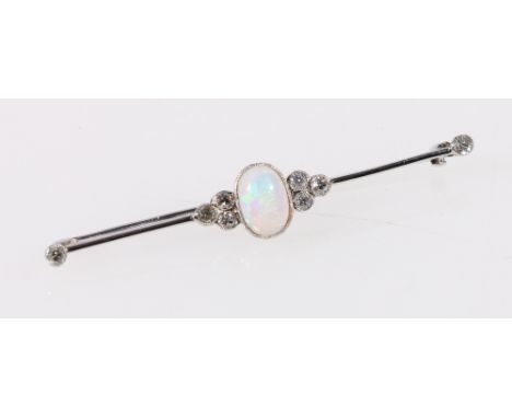 Bar brooch with an oval opal and eight diamonds, millegrain set in white gold.