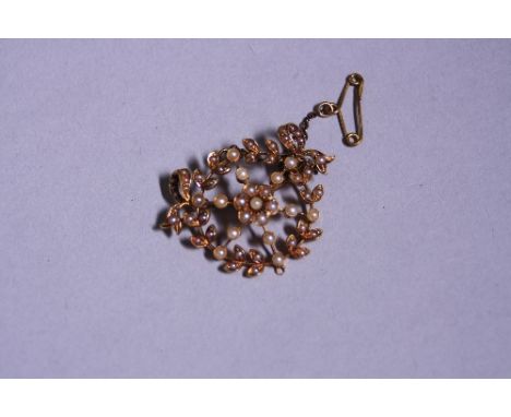 AN EDWARDIAN PEARL BROOCH, stamped 15ct