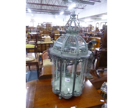A MODERN OCTAGONAL HANGING OR FREESTANDING LANTERN, with bowed glass panels and hinged top, approximate height 70cm