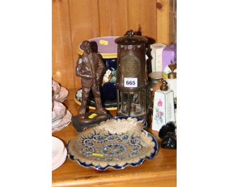 A SMALL MAJOLICA JARDINIERE AND STAND, a Doulton Lambeth dish (a/f), a miner's lamp and a model of a miner (4)