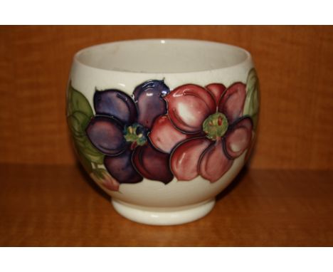 A MOORCROFT POTTERY PLANTER, Clematis pattern on cream ground, impressed and painted signature to base, height approximately 