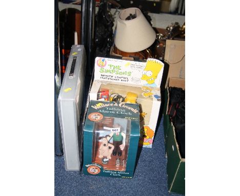 A BOXED 'WALLACE & GROMIT' ALARM CLOCK, a boxed remote control Bart Simpson on skateboard, a cased 'England The Photographic 