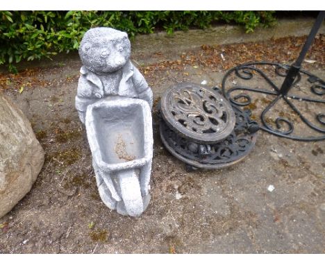 A COMPOSITE PLANTER, and three plant pot trolleys (4)