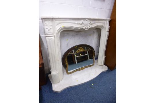 A Modern Fireplace Including A Resin Fire Surround Veined White