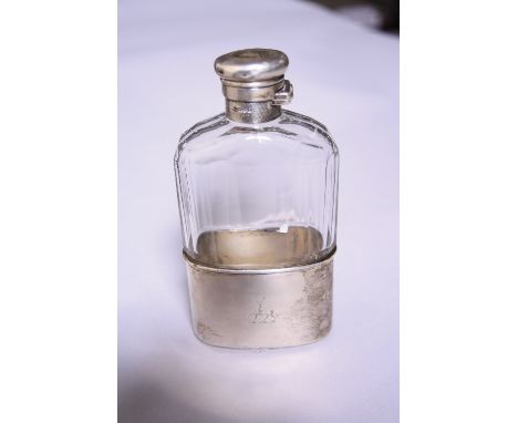 A SILVER MOUNTED HIP FLASK, the twisting hinged lid with Stag decoration, matched to silver base, London 1901, approximately 