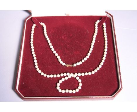 A PEARL NECKLACE, comprising of one hundred and fifteen cultured pearls with fancy clasp stamped 750, length 84cm