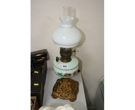 AN OIL LAMP, opaline glass well with floral decoration, glass funnel and shade