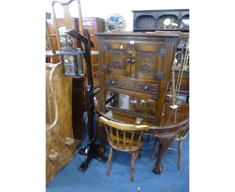A SMALL CARVED OAK TWO DOOR CUPBOARD, with drawer and an oak lead glazed hanging lantern (2)