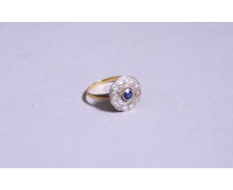 AN 18CT GOLD SAPPHIRE AND DIAMOND RING, with central sapphire within a surround of single cut diamonds, stamped 18ct, ring si