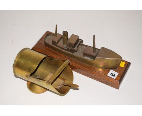 WWI trench art: a brass steam tug made from brass taken from a shell case, inscribed 'Rotherslade'; and a sugar scuttle and t