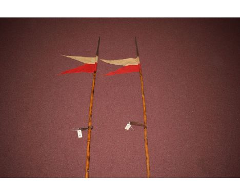 A pair of WWI British Cavalry lance, the tri-form spear heads stamped with broad-arrow marks beside C1915, no.IIP, on bamboo 