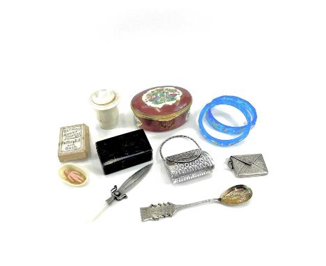 A collection of miscelleneous items including a sterling silver envelope stamp case, a 925 silver novelty bag, a George V sil