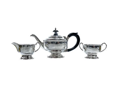 A George VI silver batchelor tea set by W Haywood, Birmingham 1945, height of teapot 13cm, weight 14.4 toz.The teapot has som