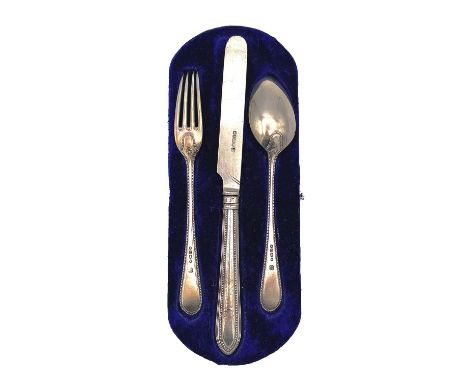 A Victorian silver three piece christening set, comprising fork, spoon and knife with silver blade and filled handle, maker R